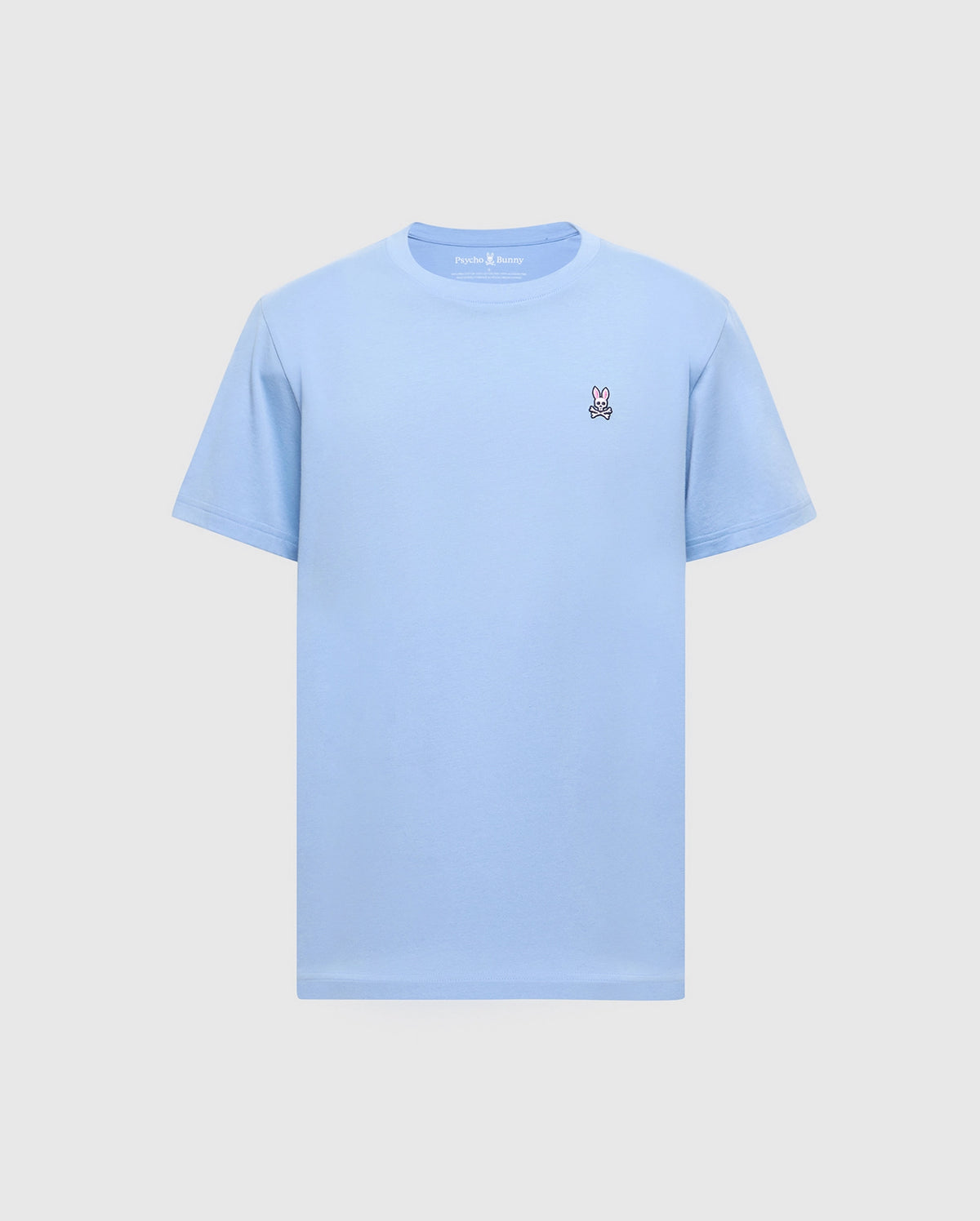 The Psycho Bunny Men's Classic Crew Neck Tee (B6U014B200) in light blue, made from soft Pima cotton, features an embroidered white peace sign hand on the left chest. Set against a grey background, it offers a seamless mix of comfort and style.
