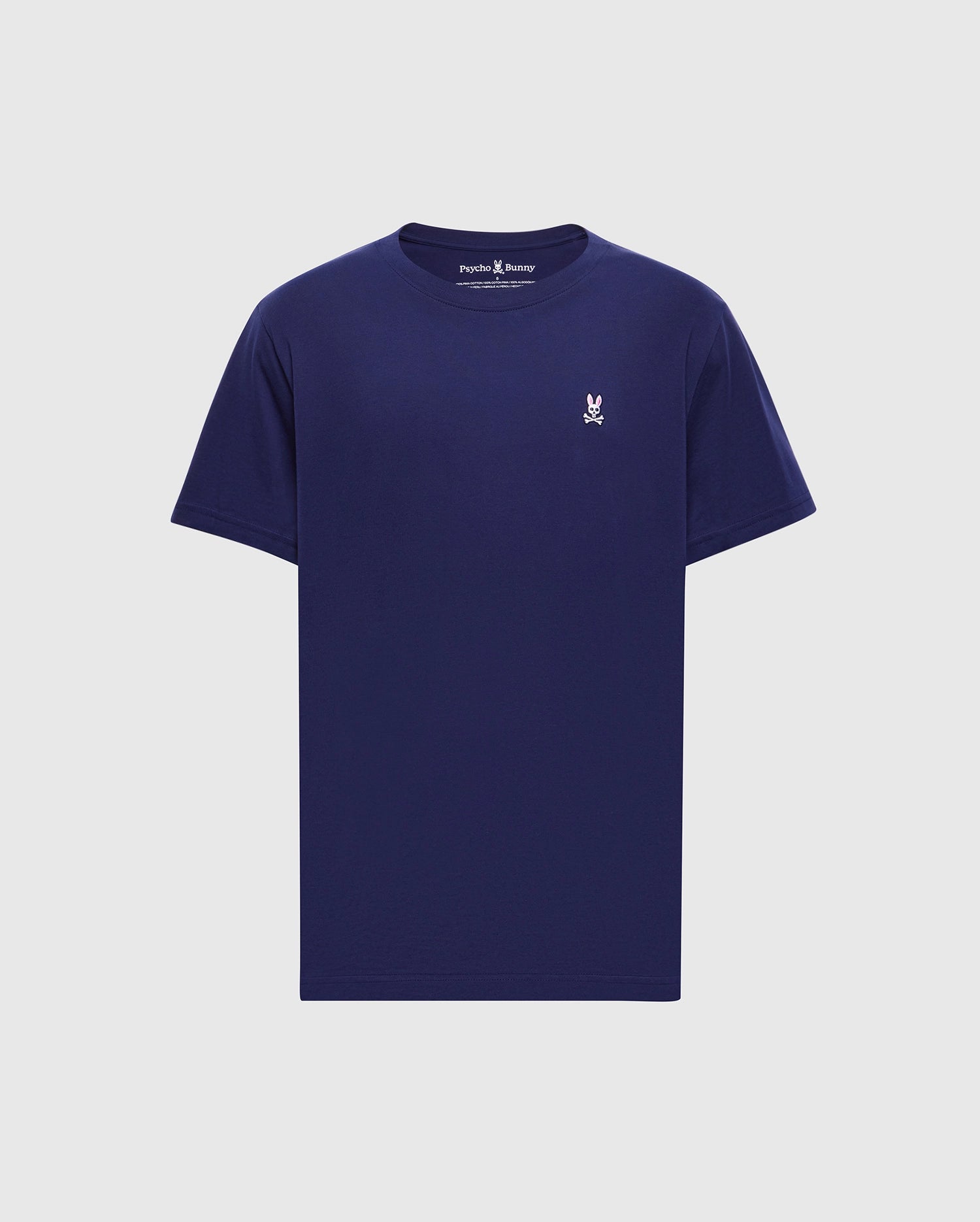 The MENS CLASSIC CREW NECK TEE (B6U014CRPC) by Psycho Bunny is a versatile navy blue pima cotton shirt with short sleeves and a small white embroidered rabbit with crossed bones logo on the left chest, perfectly contrasting its light gray background.