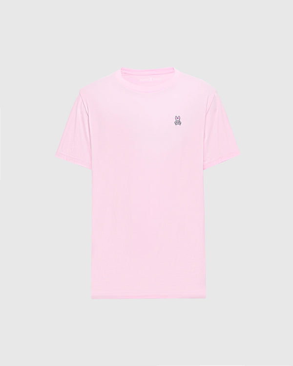 The Psycho Bunny MENS CLASSIC CREW NECK TEE - B6U014CRPC features a light pink color with short sleeves and a small embroidered peace sign on the upper left. Made from soft Pima cotton in a regular fit, it's shown on a plain gray background.