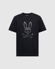 The Psycho Bunny Men's Payson Leather Print Graphic Tee (B6U213E200) is a black Pima cotton jersey tee with short sleeves and a round neckline, featuring a gray leather print of a bunny skull and crossbones on the front.