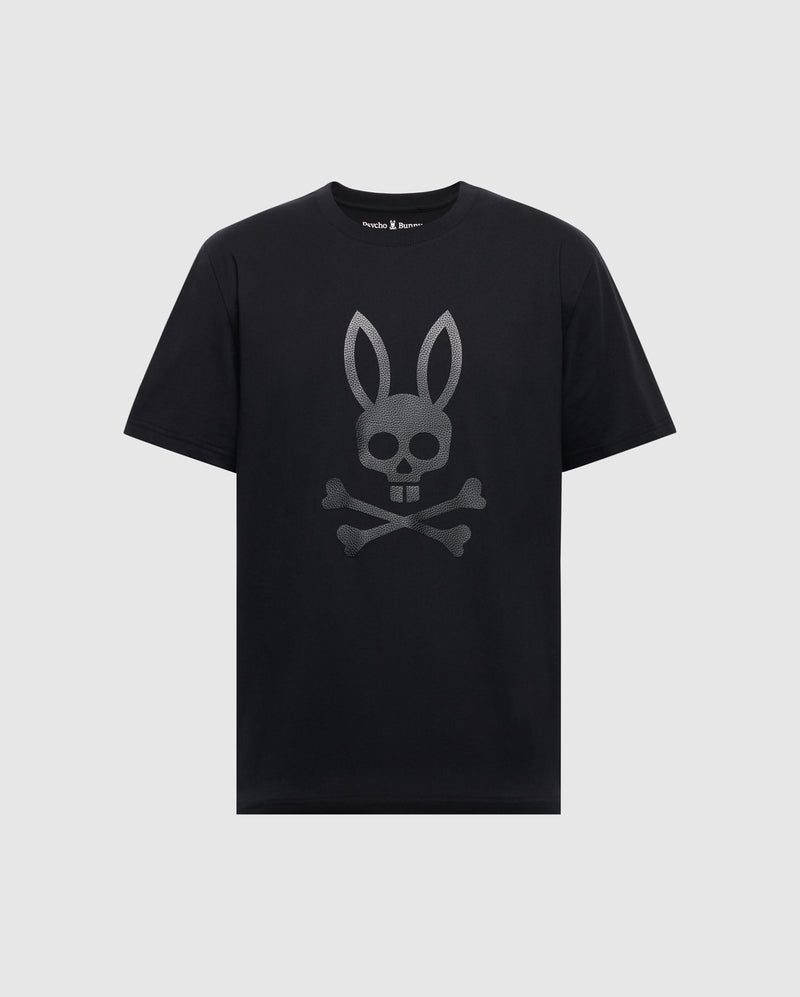The Psycho Bunny Men's Payson Leather Print Graphic Tee (B6U213E200) is a black Pima cotton jersey tee with short sleeves and a round neckline, featuring a gray leather print of a bunny skull and crossbones on the front.