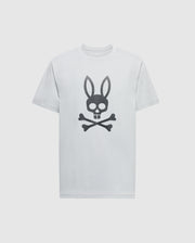 The Psycho Bunny MENS PAYSON LEATHER PRINT GRAPHIC TEE - B6U213E200 is a white Pima cotton jersey tee featuring a black leather skull with bunny ears above crossbones centered on the front.