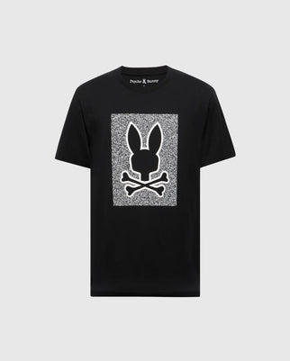 The Mens Rockton Graphic Tee (B6U247C200) by Psycho Bunny is a black Pima Cotton T-shirt, showcasing a white rectangle with a bunny head and crossbones graphic. "Psycho Bunny" text adorns the top, crafted in Peru for premium comfort and style.