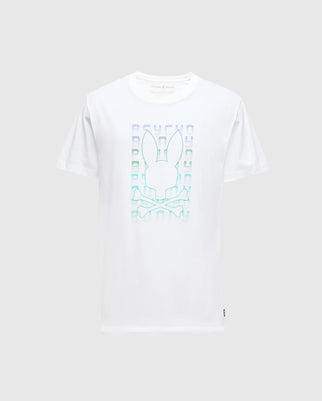 The Psycho Bunny MENS CORTES GRAPHIC TEE - B6U328E200 is a white Pima cotton T-shirt featuring a pastel-colored graphic of a stylized bunny head above crossed bones, set against a grid pattern with a holographic effect.