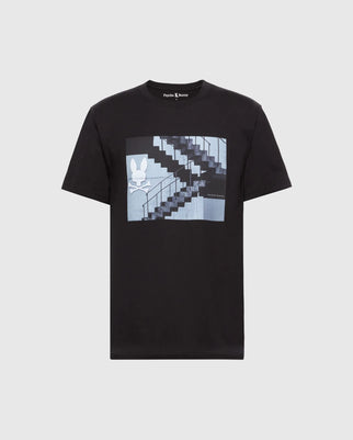 Introducing the Psycho Bunny Men's Dean Photo Real Tee - B6U390E200: a black Pima cotton T-shirt featuring a staircase and white bunny silhouette graphic within a blue-toned rectangle on the chest, capturing urban geometric elegance.