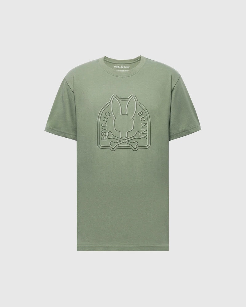 The Psycho Bunny MENS MELBOURNE GRAPHIC TEE - B6U410F200 is a sage green, eco-friendly Peruvian Pima cotton crew neck with short sleeves, featuring an embossed bunny and "Psycho Bunny" logo on the front in a minimalist style.