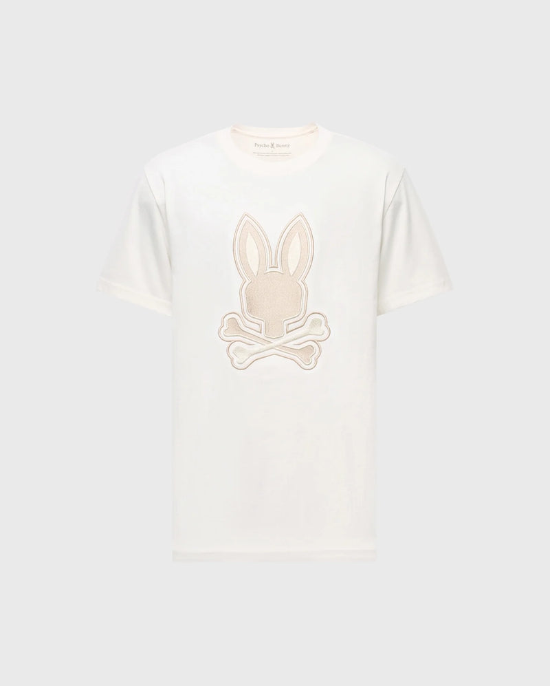 The Psycho Bunny MENS NEW CASTLE EMBROIDERED GRAPHIC TEE (B6U415F200) features a white Pima cotton base with an embroidered Bunny head graphic, ears up, above crossed bones on a light gray background.