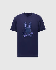The Psycho Bunny Men's New Castle Embroidered Graphic Tee, made from soft Pima cotton, features a navy blue design with an embroidered Bunny emblem of a stylized rabbit head and ears above crossed bones.