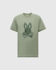 The MENS NEW CASTLE EMBROIDERED GRAPHIC TEE - B6U415F200 by Psycho Bunny is crafted from Pima cotton and features a bunny graphic with crossed bones on the front, highlighted by two-tone embroidery.