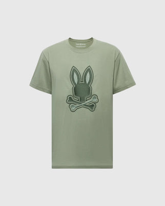 The MENS NEW CASTLE EMBROIDERED GRAPHIC TEE - B6U415F200 by Psycho Bunny is crafted from Pima cotton and features a bunny graphic with crossed bones on the front, highlighted by two-tone embroidery.