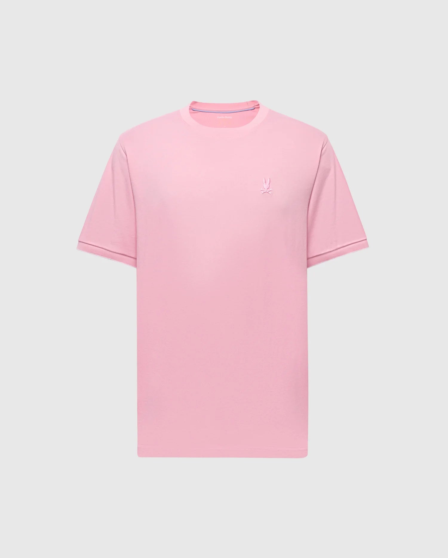 The MENS BRYCE PERFORMANCE TEE - B6U490F200 by Psycho Bunny features a plain pink design with short sleeves and a crew neck, made from a Modal-Pima cotton blend. A small embroidered logo is on the left chest, set against a light gray background.