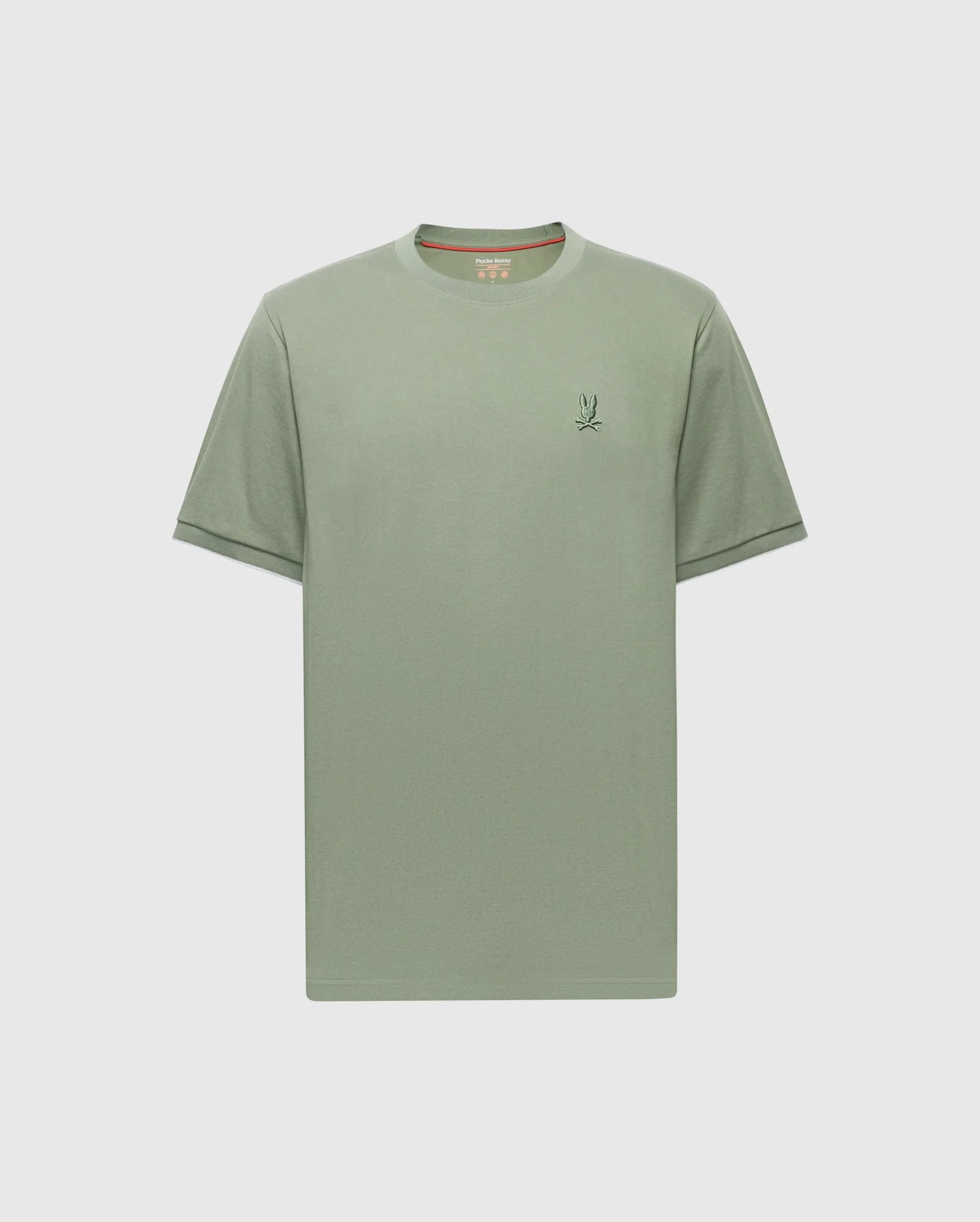 The Psycho Bunny MENS BRYCE PERFORMANCE TEE (B6U490F200) is a plain sage green Pima cotton T-shirt with short sleeves, a simple embroidered logo on the left chest, and a round neckline, highlighting Peruvian craftsmanship against a light gray backdrop.