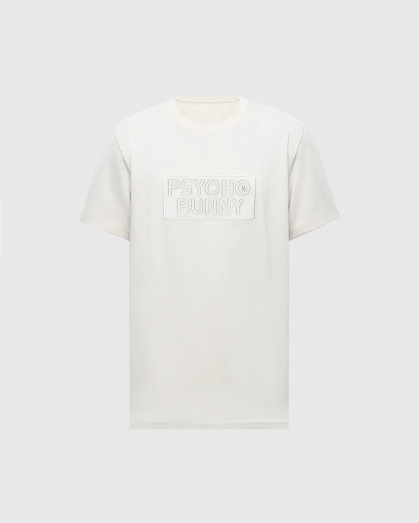 The Psycho Bunny MENS SYDNEY WORDMARK GRAPHIC TEE (B6U510F200) is a white short-sleeve Pima cotton shirt with a chest patch featuring the embossed Sydney Wordmark graphic on a light gray background.