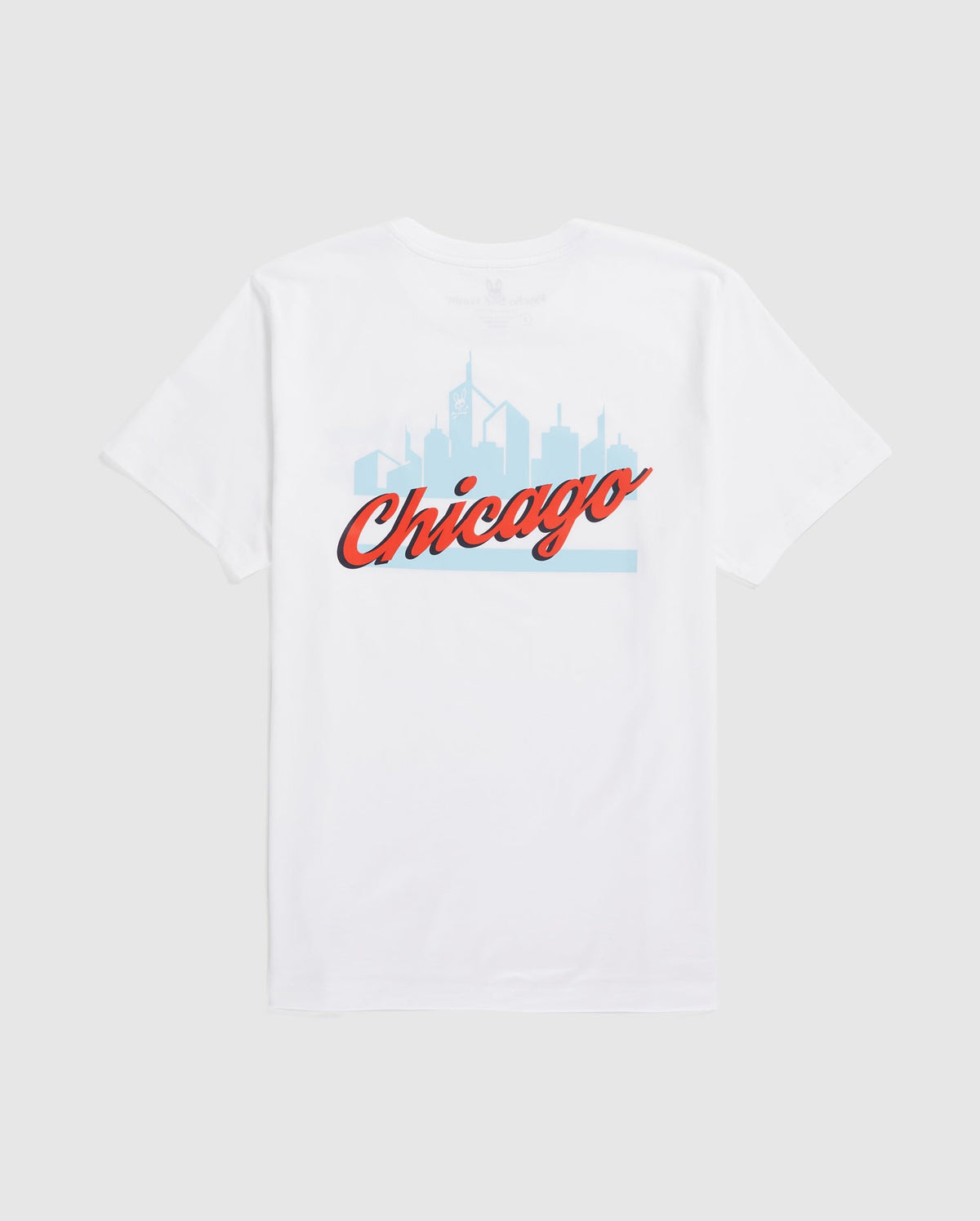 Psycho Bunny's MENS CHICAGO CITY TEE (B6U551W1PC) is a white Pima cotton shirt showcasing a light blue Chicago skyline with "Chicago" in bold, red cursive.