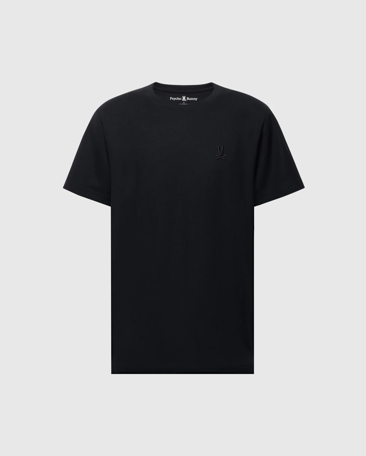 The Psycho Bunny MENS TAYLOR PIQUE TEE - B6U579F200 is a soft black Pima cotton T-shirt with short sleeves and a crew neck. An embroidered Bunny logo subtly accents the left chest, while the light gray background enhances its timeless simplicity.