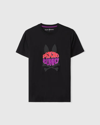 The MENS PRESTON GRAPHIC TEE - B6U611C200 from Psycho Bunny is a black Pima cotton graphic tee featuring rabbit ears and crossed bones in a muted tone. The phrase "PSYCHO BUNNY" is prominently displayed across the chest in vibrant red and pink letters. The neckline has a purple interior label with the brand name "Psycho Bunny".