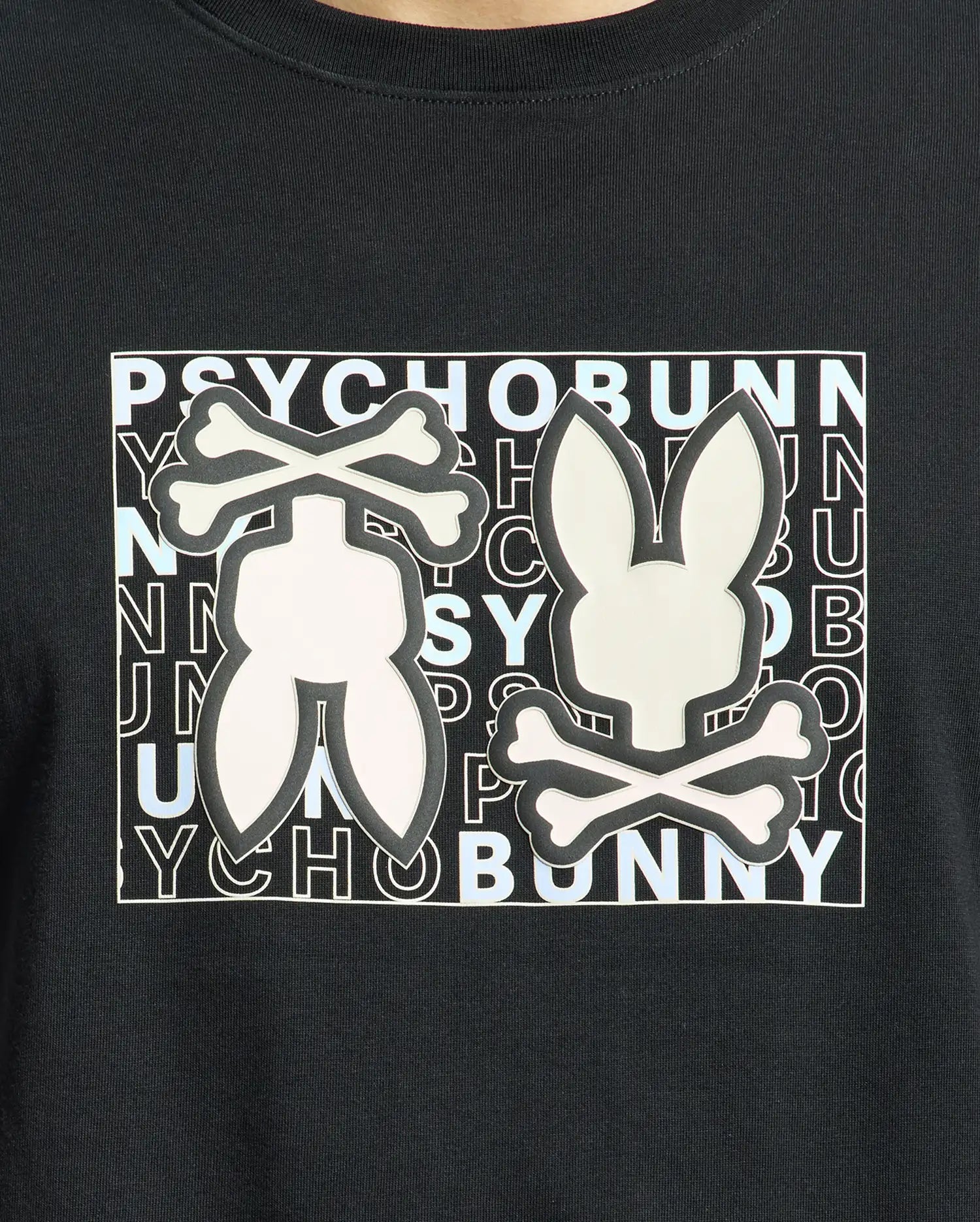 The Psycho Bunny MENS GOLD COAST GRAPHIC TEE - B6U631F200 is a black, premium Pima cotton shirt featuring a graphic bunny silhouette with crossbones over "PSYCHO BUNNY" text, offering style and classic fit comfort.