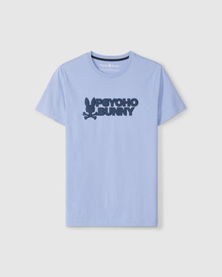 The Men's Melvin Graphic Tee - B6U663C200 by Psycho Bunny is a light blue Pima cotton shirt featuring a dark blue HD-silicone "Psycho Bunny" text logo and a small bunny graphic on a plain white background.