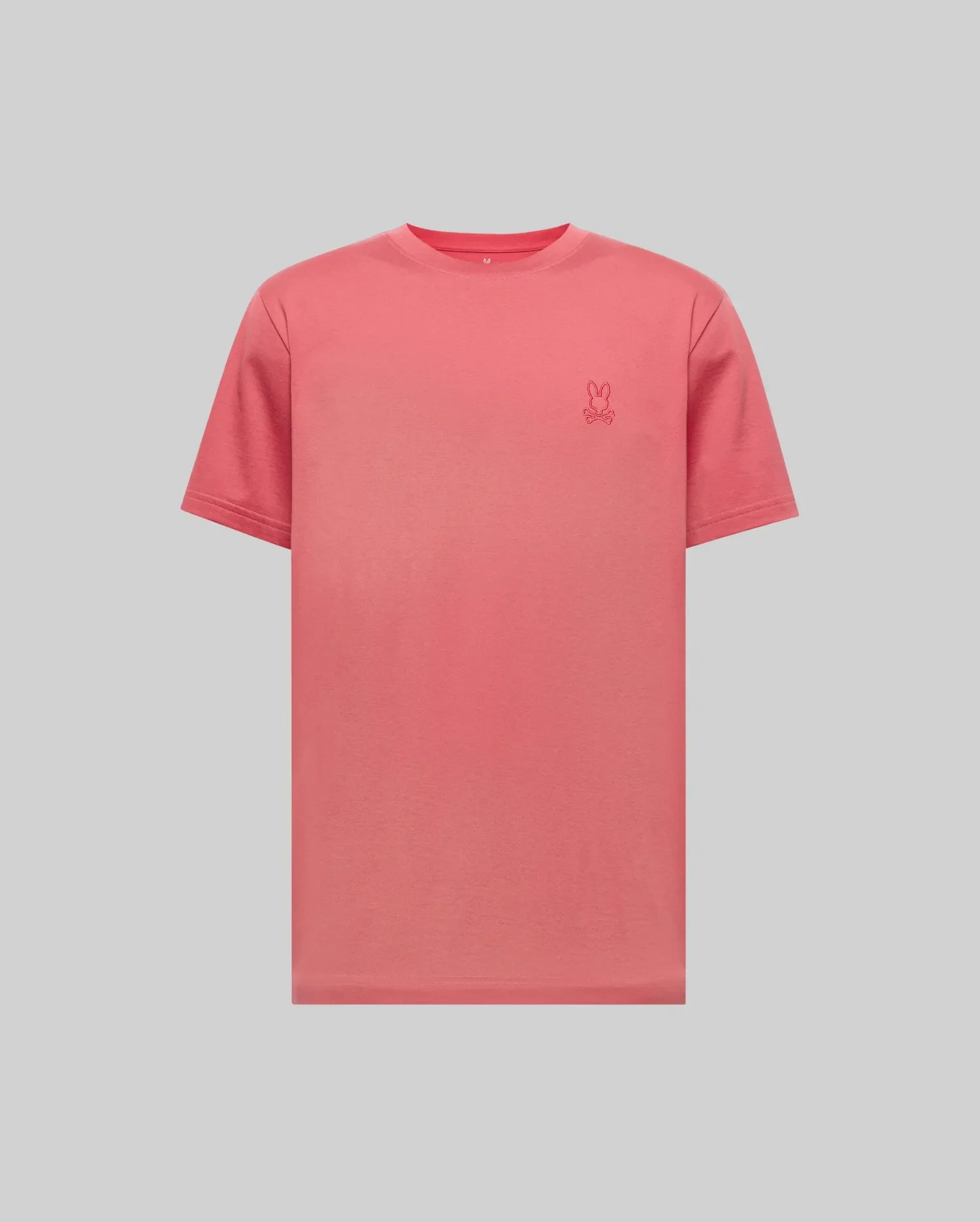 The Psycho Bunny MENS JAMES PREMIUM CREW NECK TEE (B6U952D200) is a regular fit coral pink Pima cotton short-sleeve t-shirt with premium embroidered small bunny logo on the left chest, shown on a light gray background.