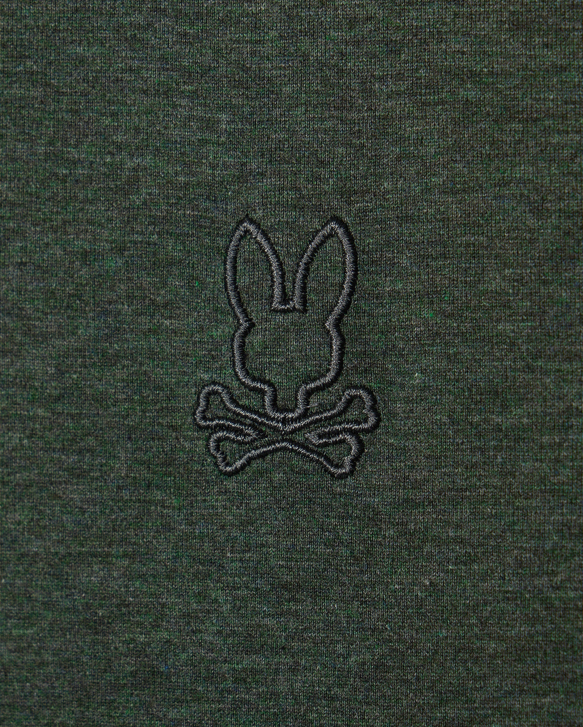 Introducing the Psycho Bunny MENS JAMES PREMIUM CREW NECK TEE - B6U952D200: This premium Pima cotton t-shirt in dark green features an embroidered design of a rabbit's head above crossed bones, reminiscent of a Jolly Roger symbol. The stylish crew neck boasts a design stitched in black thread.