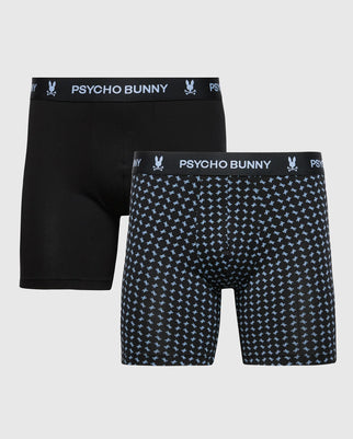 The Psycho Bunny MENS 2 PACK BOXER BRIEF (B6V495F200) includes one solid black and one black with a light blue bunny print, both made from ultrasoft Pima cotton and featuring the PSYCHO BUNNY logo waistband.