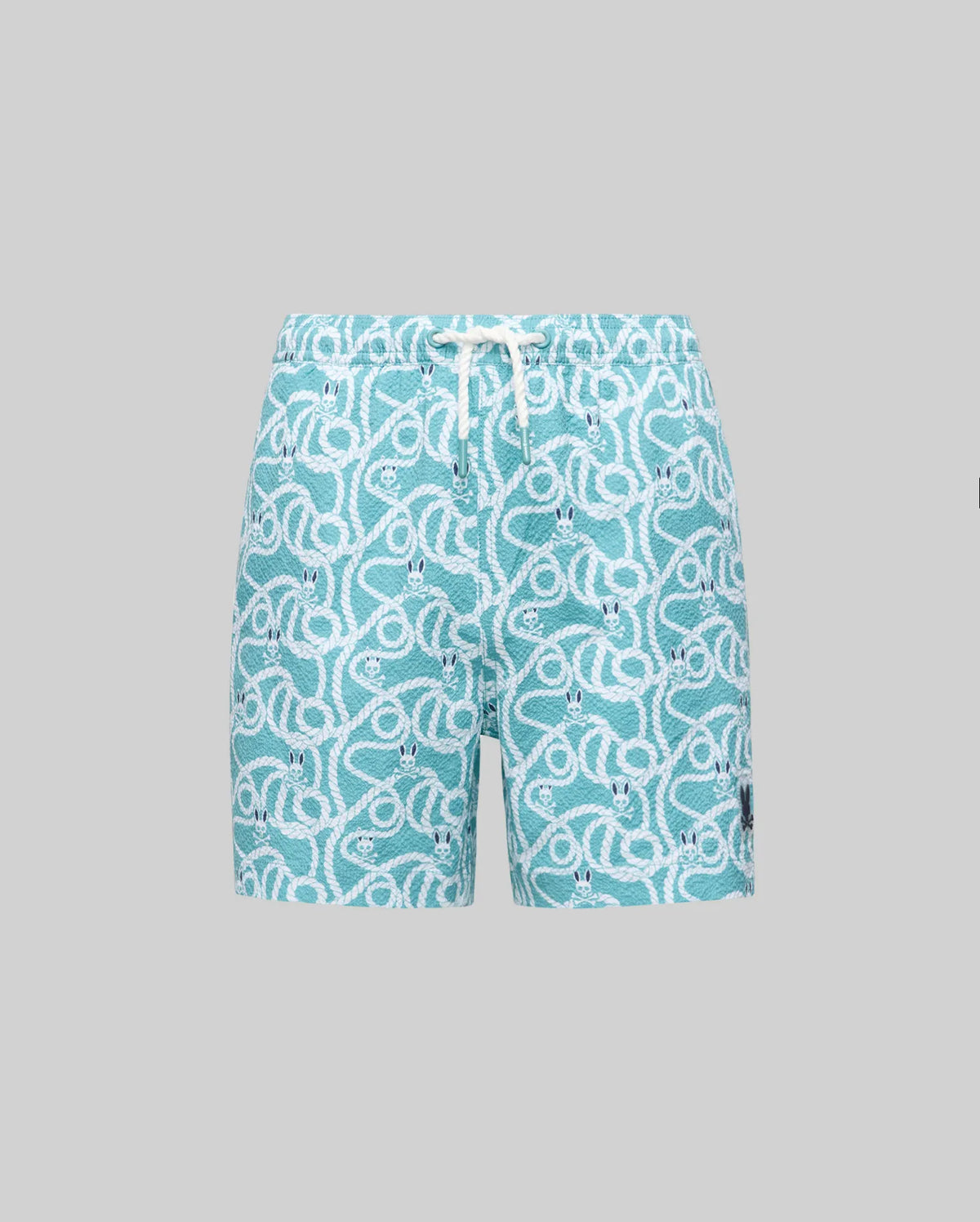 The Psycho Bunny KIDS CYRUS ALL OVER PRINT SWIM TRUNK - KB1000001 features a turquoise, quick-drying fabric with a white rope and knot pattern, elastic waistband, white drawstring, black patch by the hem, shown on a light grey background.