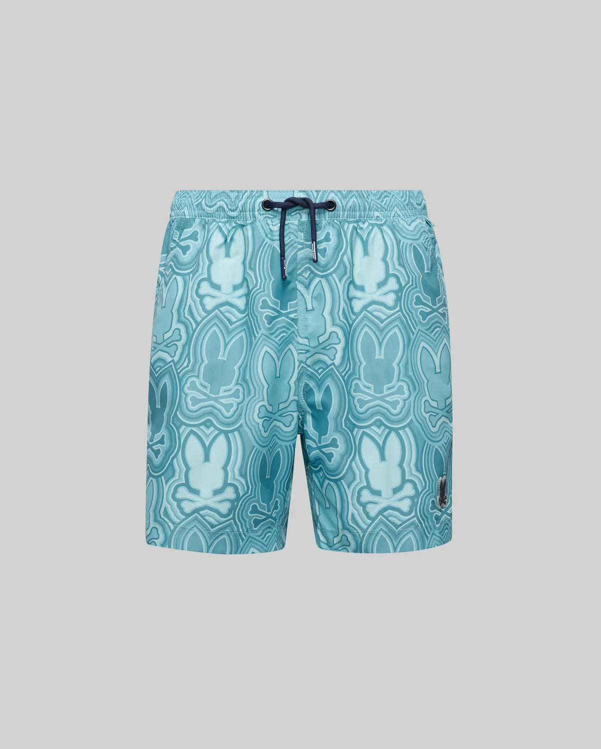 The Psycho Bunny KIDS CHUCK ALL OVER PRINT LIGHTWEIGHT SWIM TRUNK (KB1000002) features recycled polyester in light blue, a dark blue drawstring, and an abstract Bunny print in various blue shades on gray.