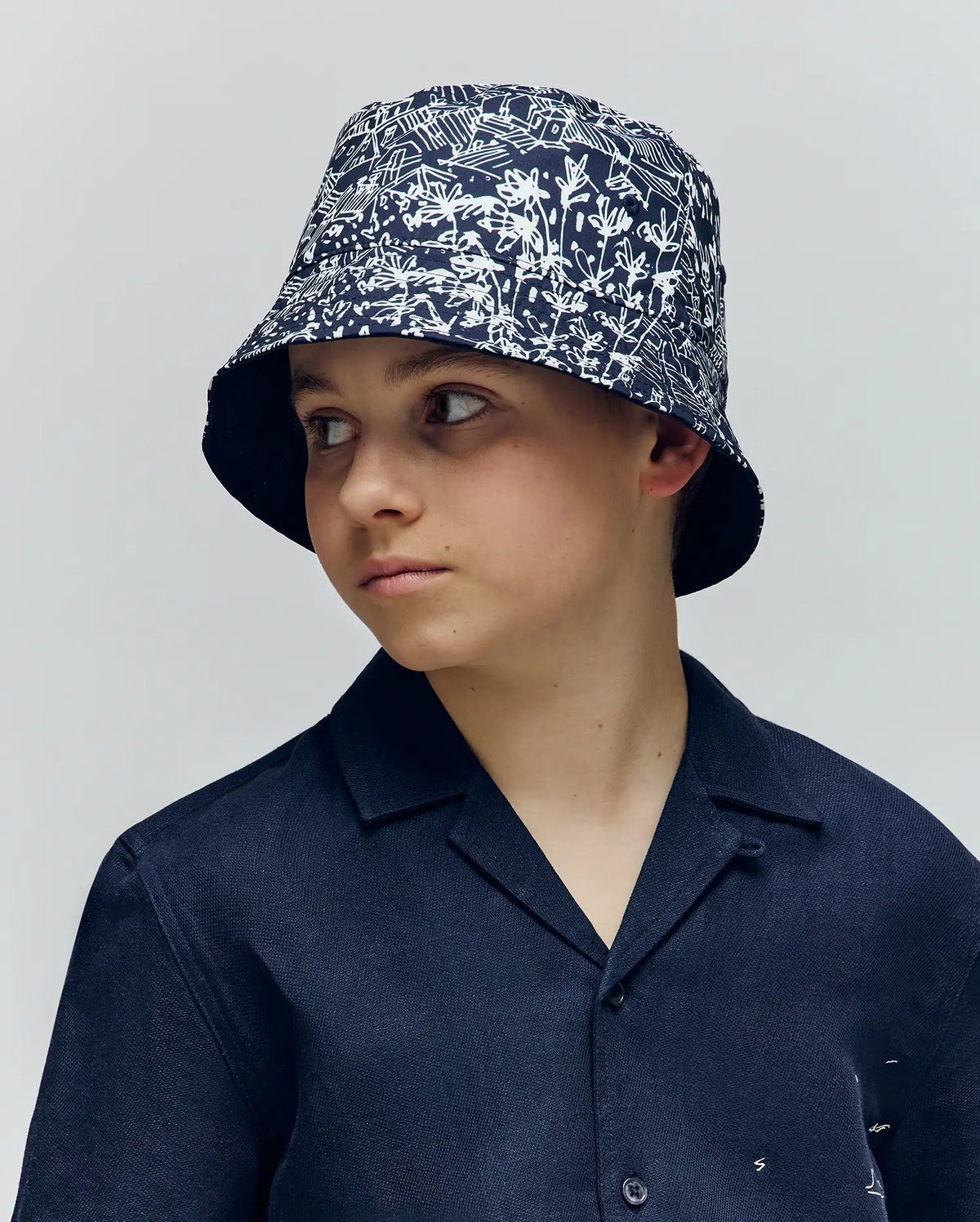Kids Blue Naxos Reversible Bucket Hat | Psycho Bunny