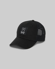 The Psycho Bunny KIDS DARIO TRUCKER CAP (KO1500009) is a black mesh hat with a curved brim, adjustable snap-back, and features a front patch of a white rabbit head above crossed bones on a black square background.