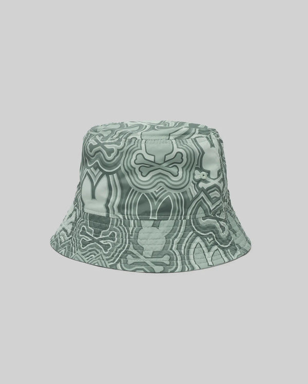 The Psycho Bunny KIDS CHUCK REVERSIBLE BUCKET HAT (KO1500015) with an abstract wavy green and white design is shown on a plain light gray background.