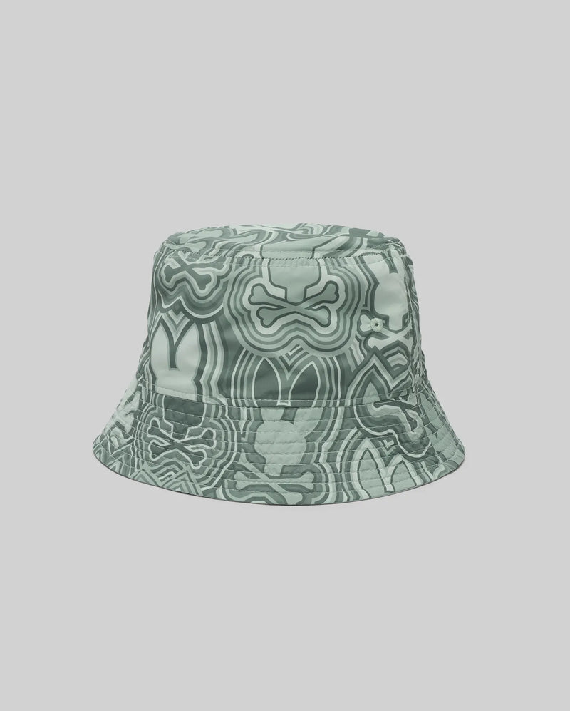 The Psycho Bunny KIDS CHUCK REVERSIBLE BUCKET HAT (KO1500015) with an abstract wavy green and white design is shown on a plain light gray background.