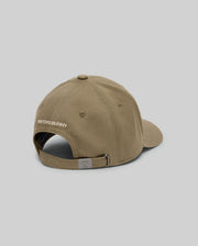 The KIDS WADE BASEBALL CAP (KO1500016) by Psycho Bunny is shown from the back in khaki cotton twill, with "PSYCHO BUNNY" and an embroidered Bunny above its adjustable strap and metal clasp, set against a plain gray background.