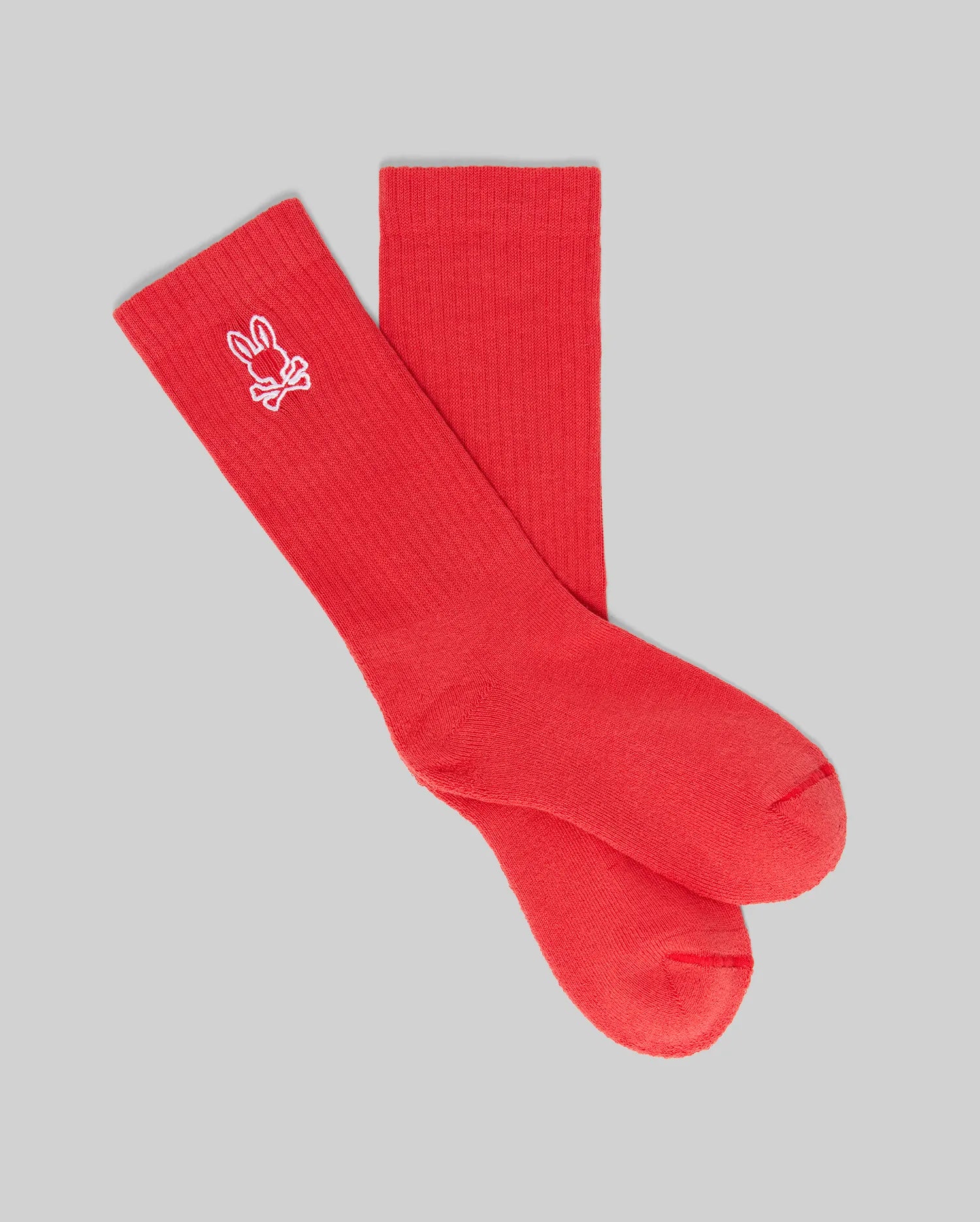 A set of three Psycho Bunny KIDS SPORT SOCKS (KO2200001), made from soft Pima cotton with spandex, featuring a small white bunny logo near the top, shown on a light gray background.