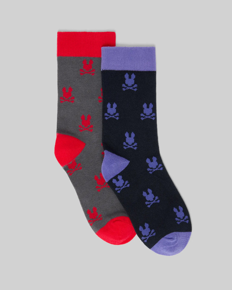 The KIDS 2 PACK ALL OVER BUNNY DRESS SOCK (KO2200003) by Psycho Bunny features two Pima cotton pairs: gray with red skull-and-bunny details and navy with purple accents, both displayed on a light gray background—fun for formalwear.