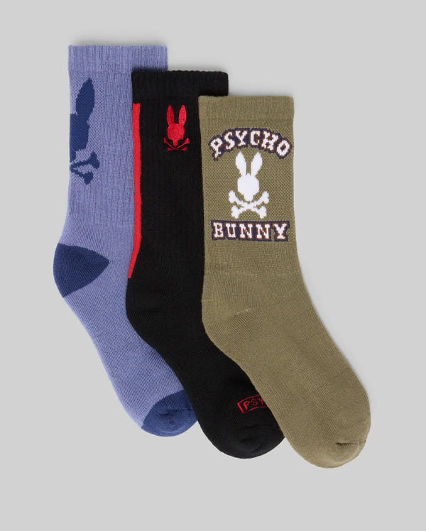 The KIDS 3 PACK SPORT SOCKS (KO2200005) by Psycho Bunny includes blue, black, and olive green pairs, each with the bunny skull-and-crossbones logo; the olive green pair also features "Psycho Bunny" text above and below the logo.