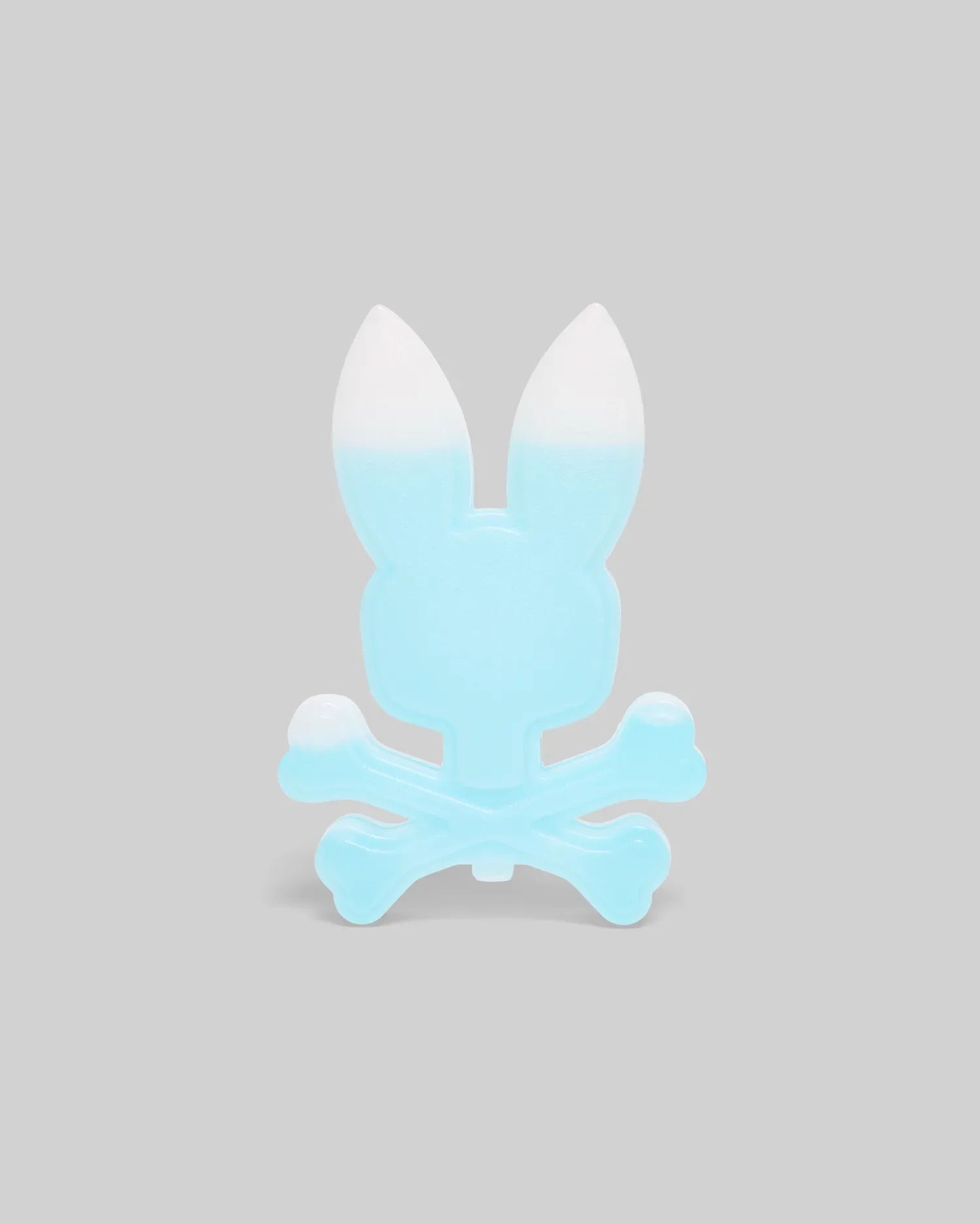 A light blue, translucent bunny with upright ears sits above crossed bones in a playful skull-and-crossbones style, like the mascot of the Psycho Bunny ICE PACK (KO2400001), set against a plain gray background.