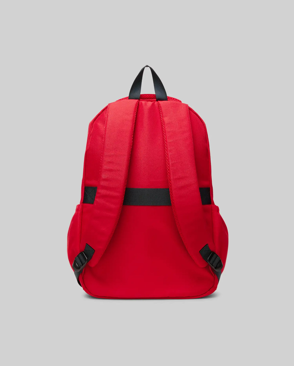 The Psycho Bunny KIDS PSYCHO BUNNY BACKPACK - KO2400004 is displayed from the back in red canvas, with two padded shoulder straps, a black top handle, and black strap adjusters on a plain gray background.