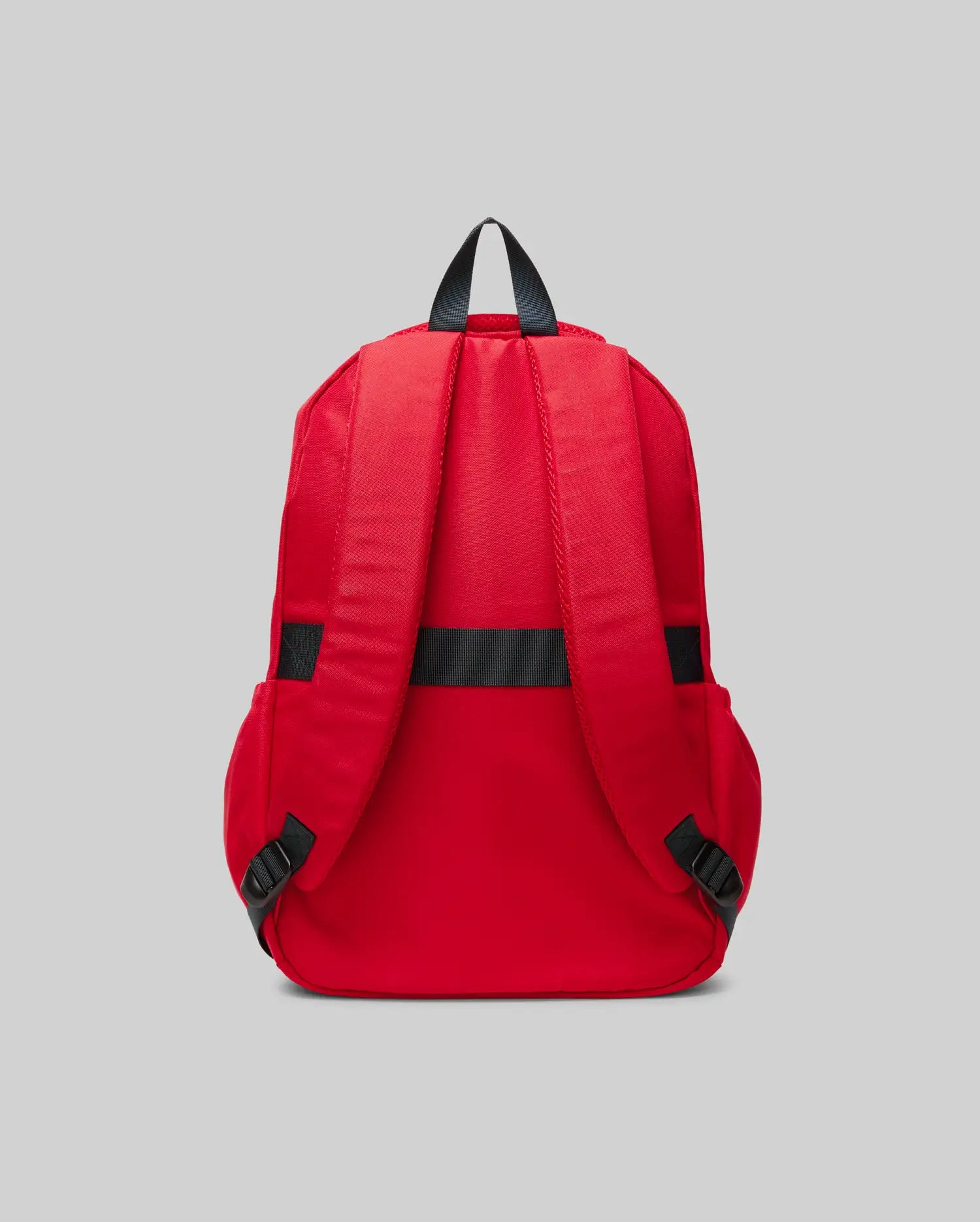 The Psycho Bunny KIDS PSYCHO BUNNY BACKPACK - KO2400004 is displayed from the back in red canvas, with two padded shoulder straps, a black top handle, and black strap adjusters on a plain gray background.