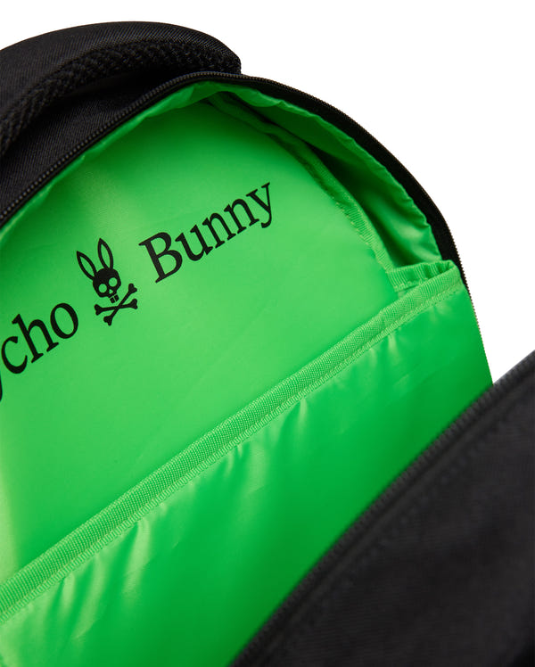 Close-up of the KIDS PSYCHO BUNNY BACKPACK - KO2400004 by Psycho Bunny in black, showing a bright green lining and the Psycho Bunny logo and name printed in black on the inner pocket of this durable canvas backpack.