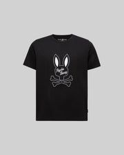 The KIDS DEREK CENTER GRAPHIC TEE (KT0200006) by Psycho Bunny features a soft black Pima cotton design with a white bunny ears and crossed bones graphic, plus "Psycho Bunny" in script on the front, shown on a plain grey background.