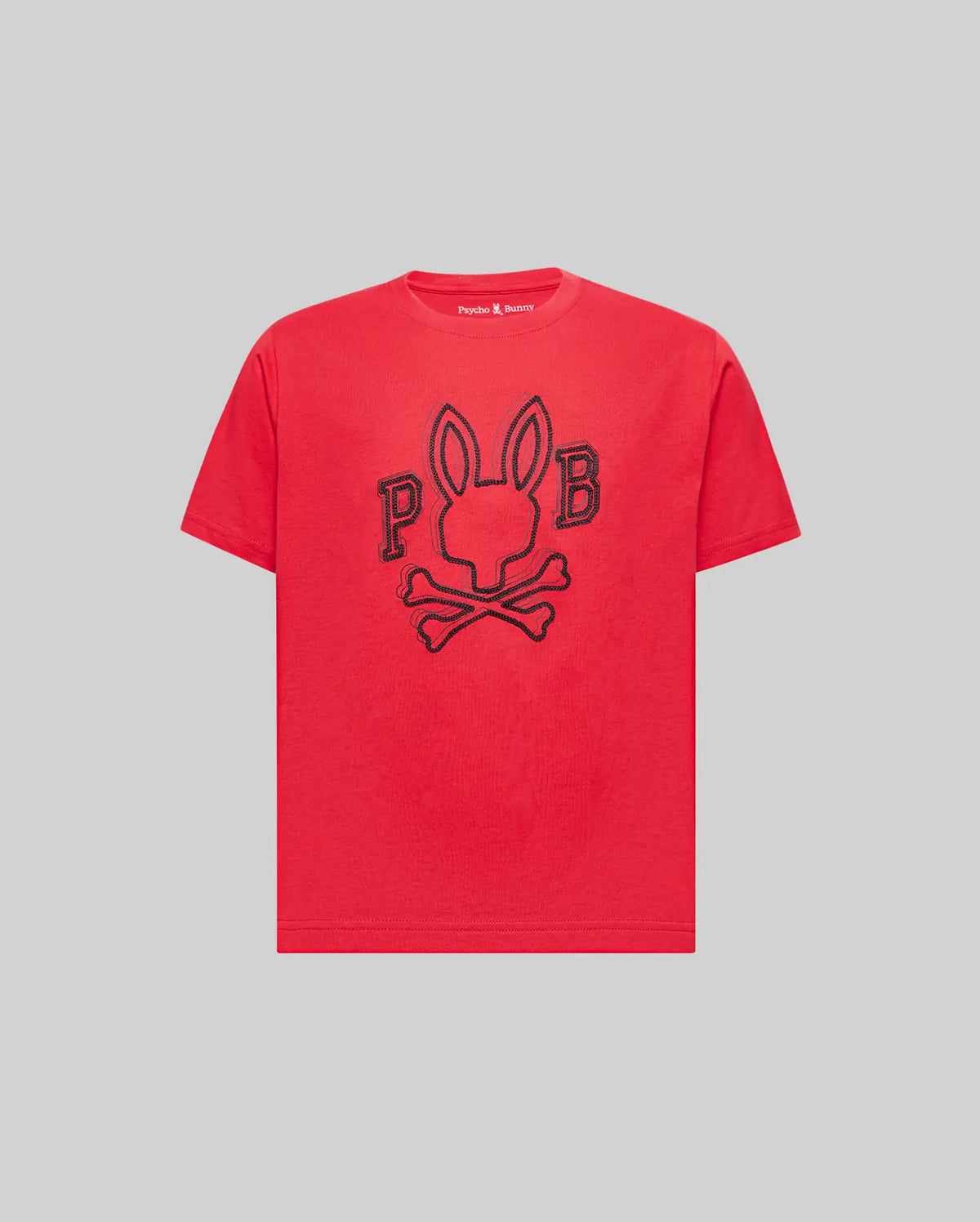 The Psycho Bunny KIDS BALES GRAPHIC TEE (KT0200021) is a red Pima cotton shirt with a bold black outline rabbit-head-and-crossbones graphic, flanked by “P” and “B,” shown on a plain gray background. Perfect for year-round wear.