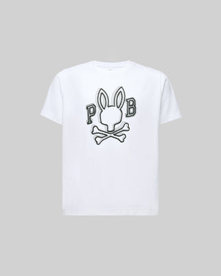 The Psycho Bunny KIDS BALES GRAPHIC TEE (KT0200021) is crafted in soft Pima cotton and features a bold Big Bunny black-and-white head above crossed bones with "P" and "B" on either side, set against a plain gray background.