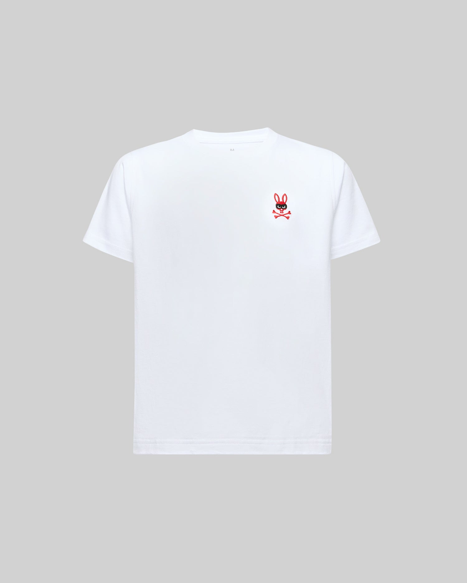 The Psycho Bunny KIDS MISCHIEF BUNNY TEE (KT0200023) is a plain white short-sleeve shirt featuring a small red and black cartoon bunny logo on the left chest, shown against a light gray background.