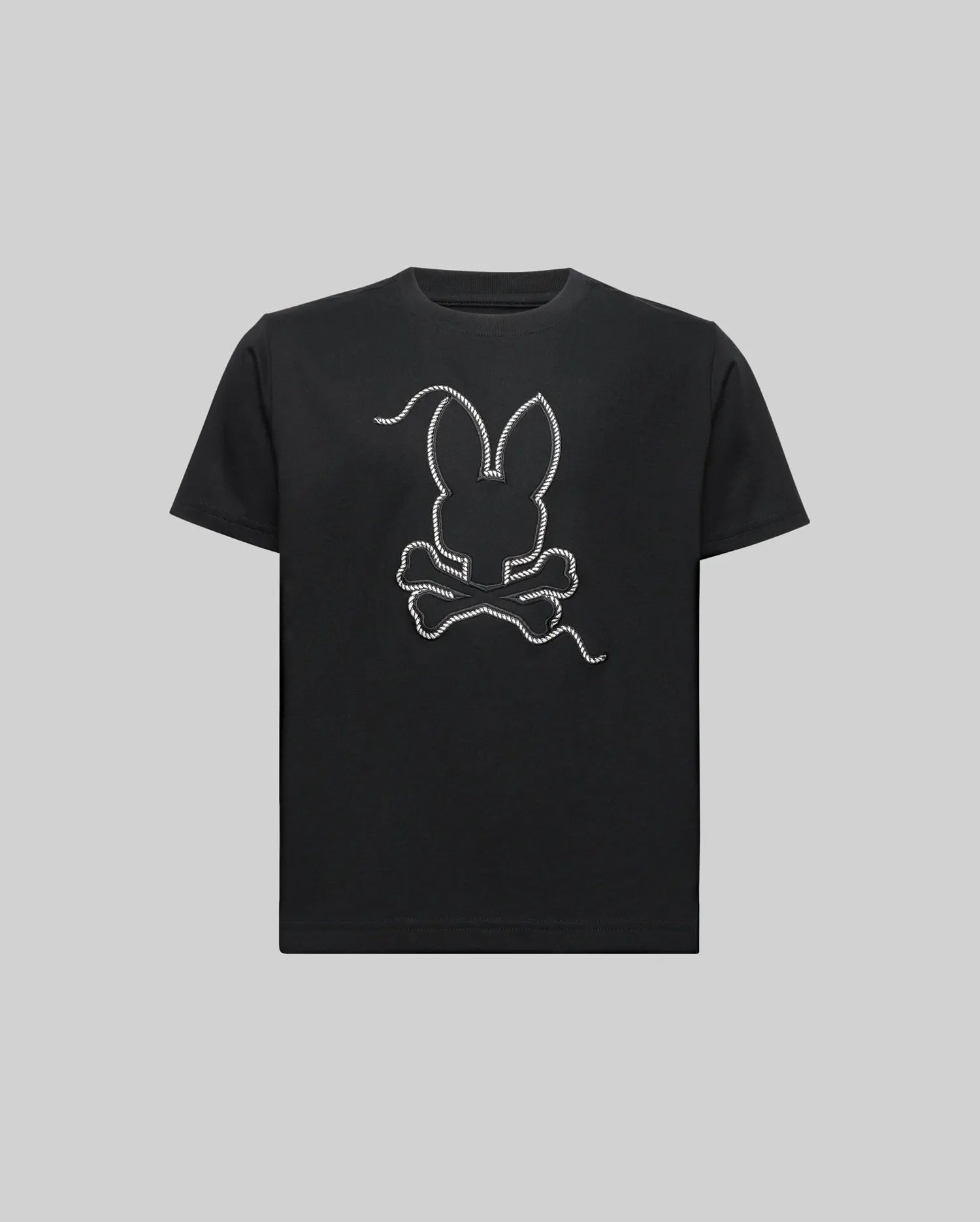 The KIDS CYRUS GRAPHIC TEE (KT0200047) by Psycho Bunny features a white outlined bunny head with long ears above crossed bones, centered on the chest. Made from ultra-soft Pima cotton, it comes in gray and channels a sailor’s spirit.