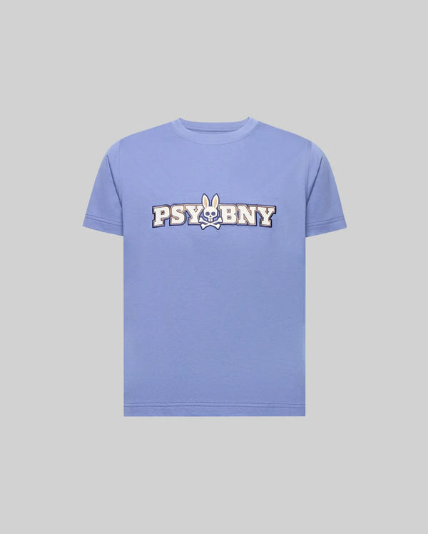 The KIDS WADE GRAPHIC TEE - KT0200055 by Psycho Bunny is a light purple, regular-fit 100% cotton tee with a cartoon bunny logo and bold white "PSYBNY" lettering on the chest, shown against a plain gray background.