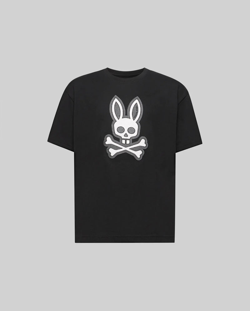 The Psycho Bunny KIDS RYDER OVERSIZED FIT TEE (KT0200056) is a black premium tee crafted from soft Pima cotton, featuring a white embroidered Bunny skull with bunny ears above crossed bones against a gray background.