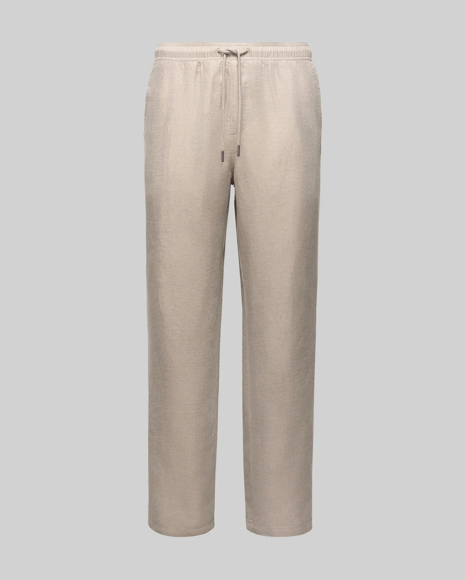 The Psycho Bunny MENS FARRIS WIDE LEG LINEN PANT (MB0600007) features beige linen blend fabric, relaxed fit, wide legs, elastic waistband, drawstring, and embroidered logo, shown on a plain light gray background.