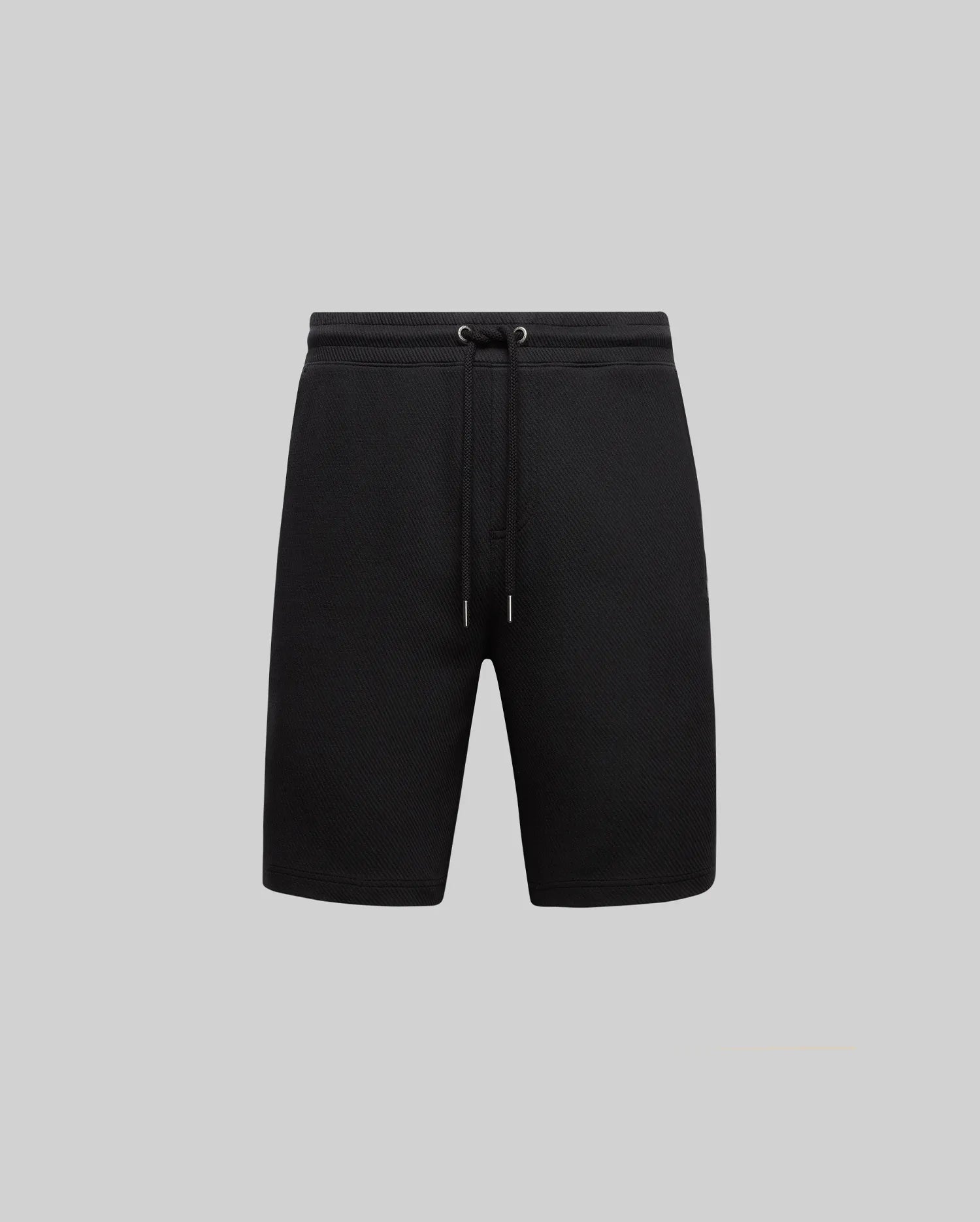 The Psycho Bunny MENS KAI SWEATSHORT - MB0900015 features an elastic waistband with a drawstring, twill-textured fabric, and an embroidered Bunny logo. Displayed on a plain light gray background for a minimalist look.