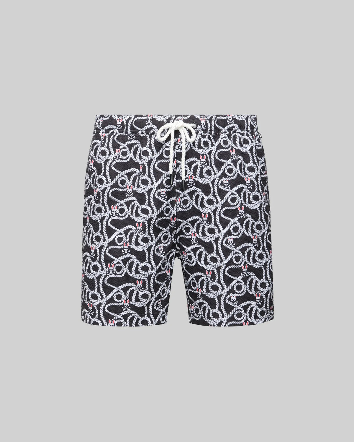 The Psycho Bunny MENS CYRUS ALL OVER PRINT SWIM TRUNK (MB1000004) features a black quick-dry seersucker fabric with an all-over white snake pattern, red accents, and a white waist drawstring, shown on a plain gray background.