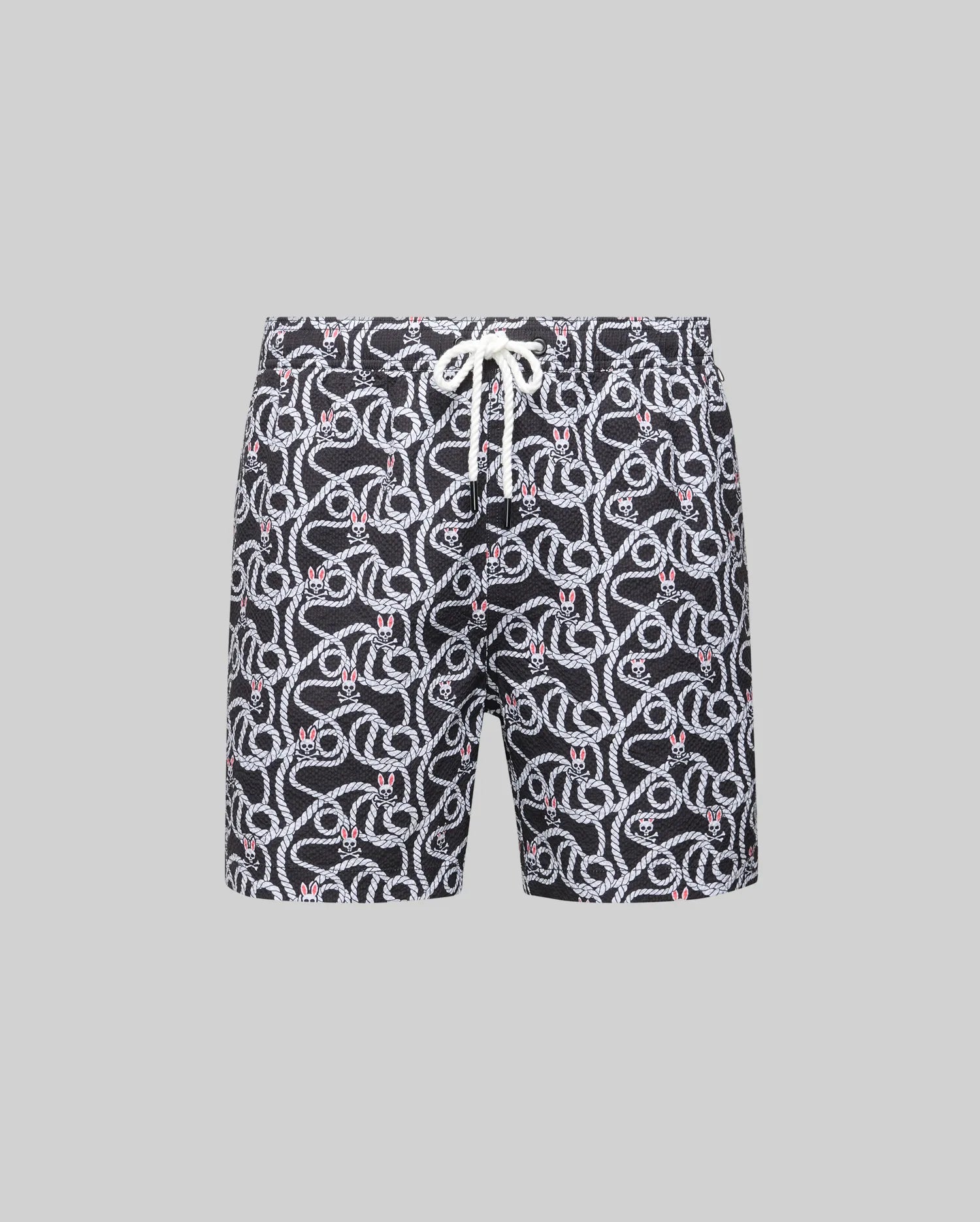 The Psycho Bunny MENS CYRUS ALL OVER PRINT SWIM TRUNK (MB1000004) features a black quick-dry seersucker fabric with an all-over white snake pattern, red accents, and a white waist drawstring, shown on a plain gray background.